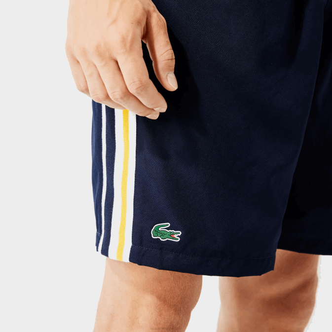 apk bleu marine jaune blanc V6HV1363 Hommes Lacoste short sport léger à bandes contrastées
