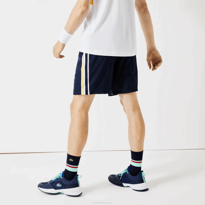 apk bleu marine jaune blanc V6HV1363 Hommes Lacoste short sport léger à bandes contrastées